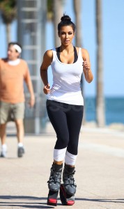 Kim and Kourtney Kardashian go pogo jogging as they film their tv show in Miami. Kim looked even taller as she tried out the shoes first while Kourtney ran behind her. Later the sisters both ran on the funny shoes on South Beach. Pictured: Kim Kardashian, Kim Kardashian Ref: SPL171229  090410   Picture by: Brian Prahl / Splash News Splash News and Pictures Los Angeles:	310-821-2666 New York:	212-619-2666 London:	870-934-2666 photodesk@splashnews.com 