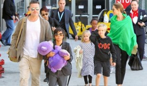 Image: 0183712312, License: Rights managed, Restrictions: NO Brazil, Los Angeles, CA - Brad Pitt, Angelina Jolie and their kids make it back to Los Angeles this morning after their stay in Australia.  The couple have been keeping busy filming their upcoming movies and recently attended the wrap party for Angelina's movie, "Unbroken" earlier this week.  50 year-old Brad looked great in a white shirt with a brown jacket and khaki pants while Angelina stood out of the crowd wearing all black with a bright green wrap.       February 5, 2014, Place: USA, Model Release: No or not aplicable, Credit line: Profimedia.com, AKM images