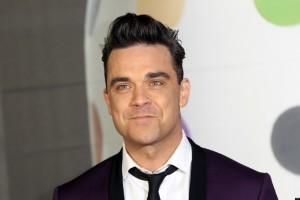 Robbie Williams seen arriving at the BRIT Awards 2013 at the o2 Arena in London on Wednesday, Feb. 20, 2013. (Photo by Joel Ryan/Invision/AP)