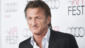 FILE - In this Nov. 13, 2013 file photo, Sean Penn arrives at the 2013 AFI Fest premiere of "Secret Life of Walter Mitty" at the TCL Chinese Theatre, in Los Angeles. While Hollywood is flush with gift suites and glamorous stars leading into the Golden Globe Awards, a spate of A-listers take time out to attend Sean Penn's Help Haiti Home dinner on Saturday, Jan. 11, 2014, and help raise funds for the island nation still recovering from the devastating earthquake of three years ago. (Photo by Richard Shotwell/Invision/AP, File)
