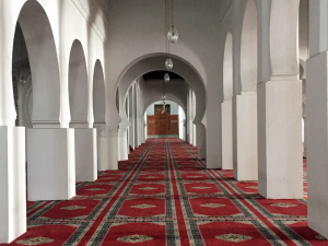 the-interior-is-a-stunning-combination-of-intricate-mosaics-and-stark-white-archways