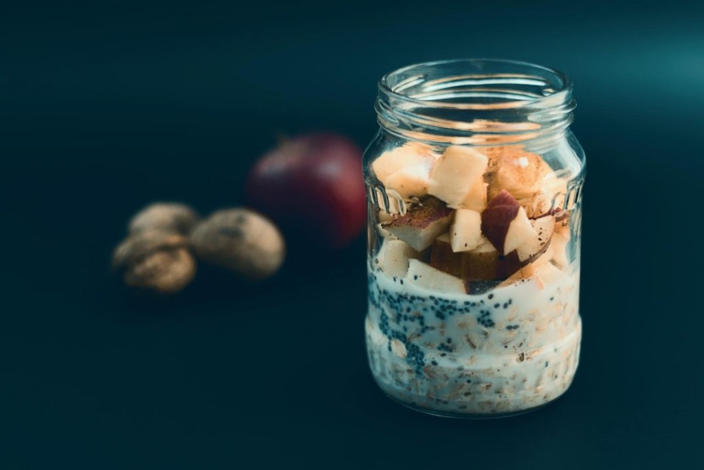 Healthy breakfast with chia seeds. Apple nut overnight oats and chia, in glass jar. Preparation overnight breakfast with flakes of oats, chia, apple, nuts., Image: 305677166, License: Royalty-free, Restrictions: , Model Release: no, Credit line: Profimedia, Alamy