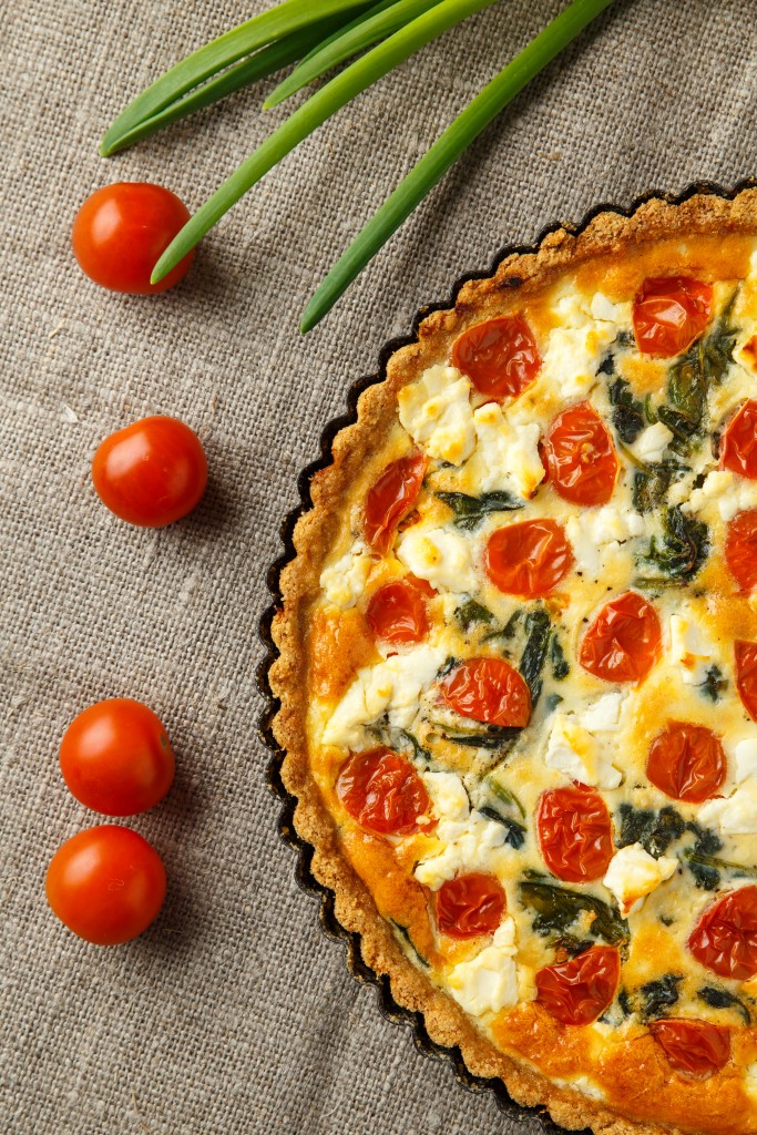 Vegetarian homemade pie, Quiche with tomatoes, spinach and feta cheese