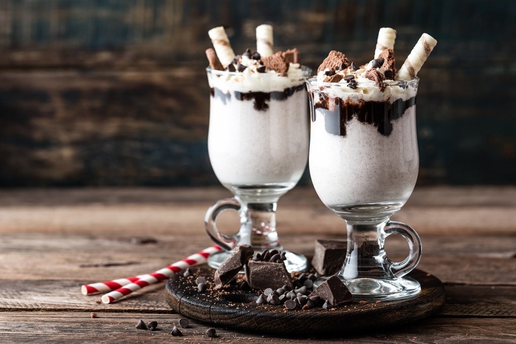delicious milkshake with ice cream, chocolate and cookies