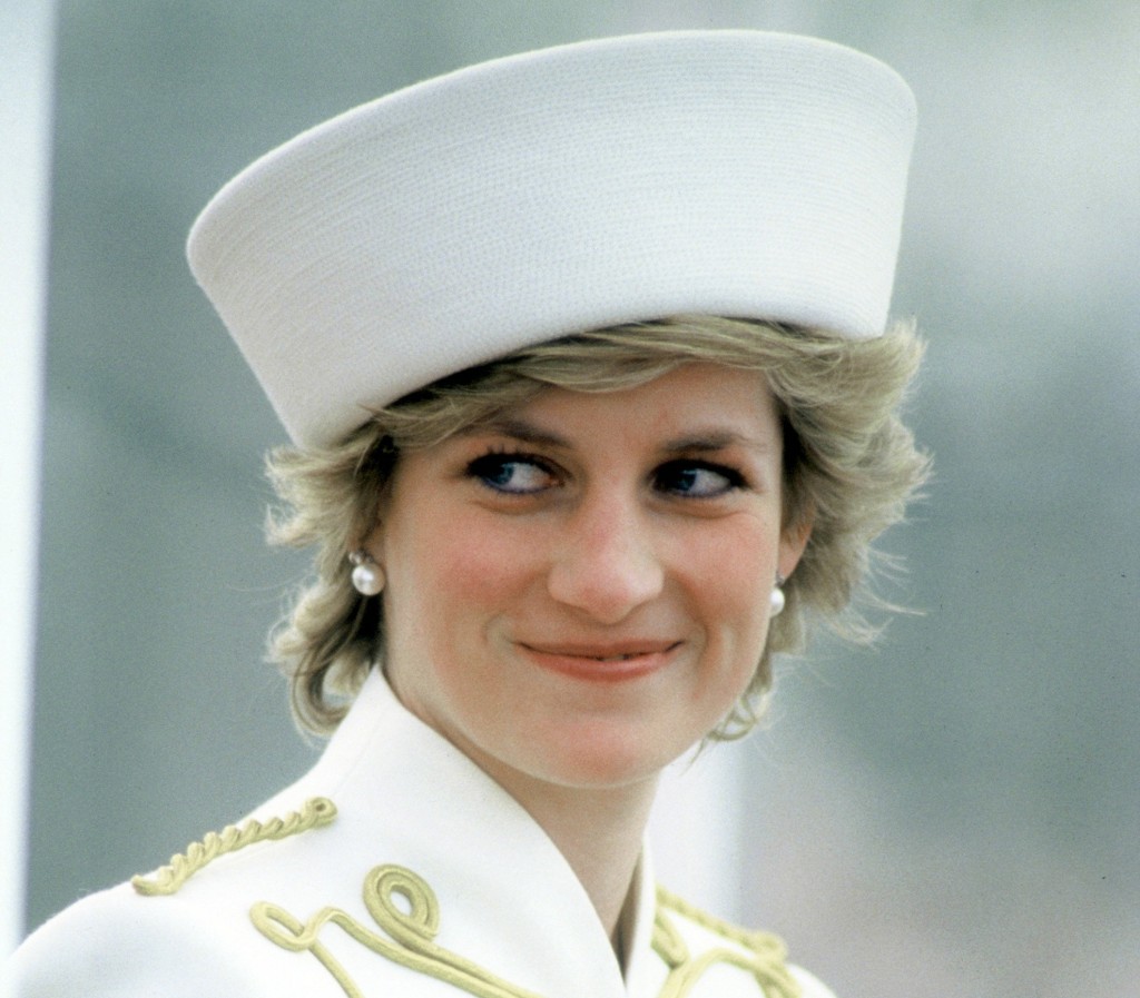 Princess Diana wearing a Catherine Walker military style white suit with drum majorette gold frogging and epaulettes during a visit to the Royal Military Academy Sandhurst. Surrey, England - 04.87 Featuring: Princess Diana Where: Surrey, United Kingdom When: 01 Jan 1987 Credit: WENN