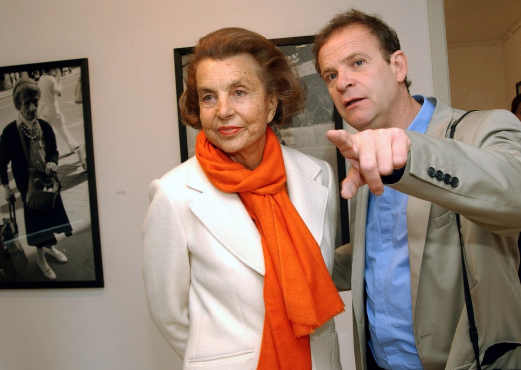 (dpa file) - French photographer and author Francois-Marie Banier (R) presents his exhibition to L'Oreal matriarch Liliane Bettencourt at the Museum ?Hans Lange? in Krefeld, Germany, 13 June 2004. The billionaire and L?Oreal heiress is in conflict with her only daughter - and an end is not in sight. Francoise Bettencourt- Meyers accuses her 86 year-old mother of throwing around with money due to mental incapacity. She is said to have given Francois-Marie Banier presents worth some one billion Euro. Mrs Bettencourt-Meyers has reported to the state attorney?s office. Photo: Horst Ossinger