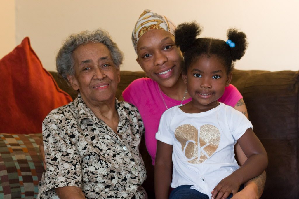 (front left) Grandmother Juanita Hubbard, 86, her granddaughter Erica Bennett, 30, and Juanita's great-granddaughter Dayianna Bush, 3. - Javage, Logan/Sun-Times